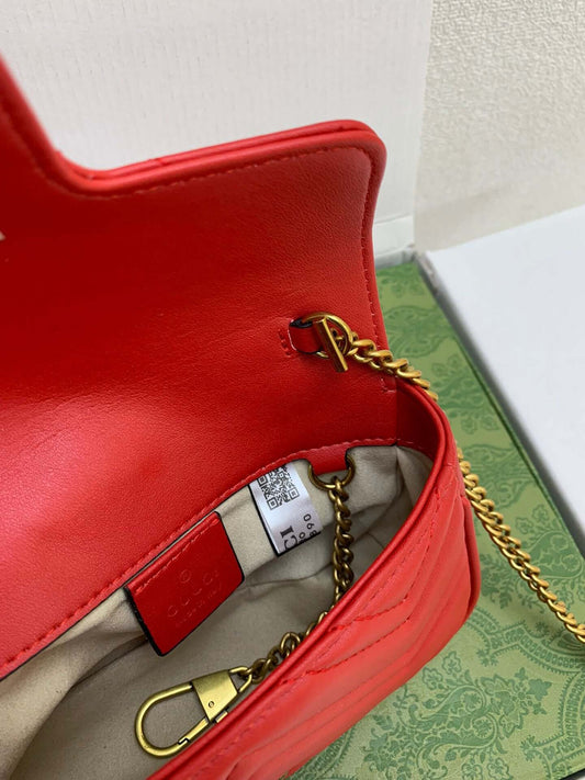 "Gucci's Timeless Sophistication: Luxurious Red Leather Chain Shoulder Bag – A Designer Marvel for the Stylish Woman's Large-Capacity Quilted Messenger, Handbag, Purse, and Shopping Wallet."